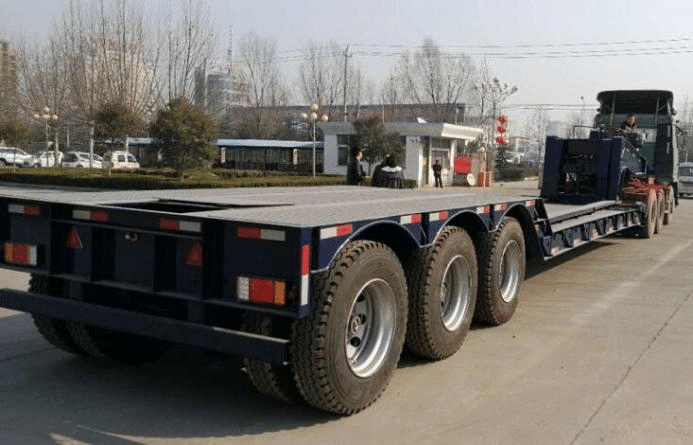 Low bed trailer with hidden tyres
