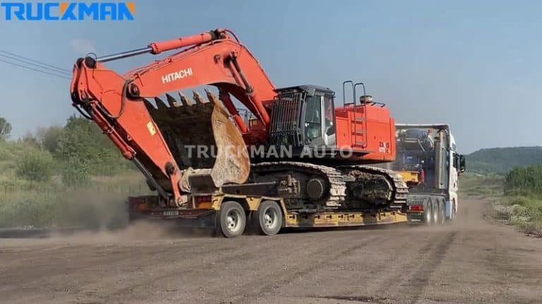 Low-bed semi-trailer truck transporting HITACHI excavator with efficient loading capacity