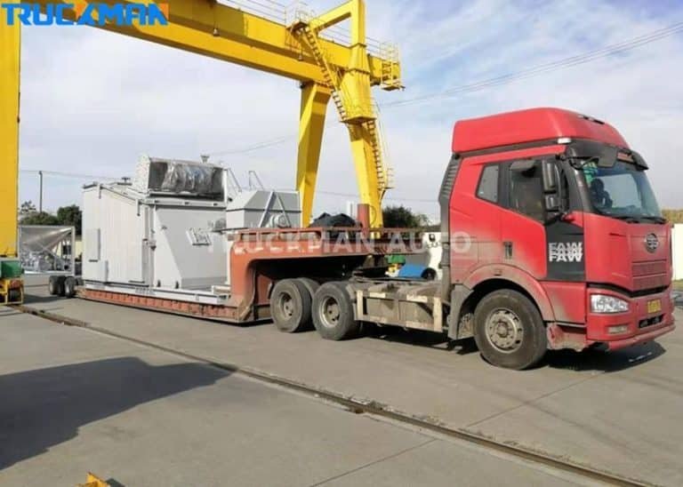 Low-bed semi-trailer transporting large industrial generators, trailer use in specialised equipment logistics.