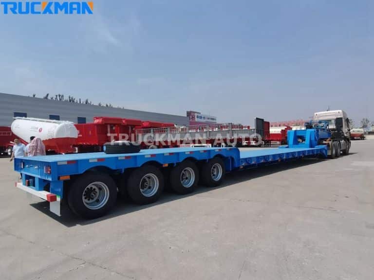 Blue flatbed semi trailer connected to a tractor truck, highlighting proper trailer connection for safe transport