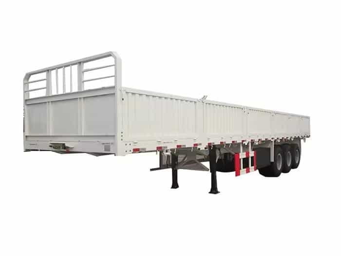 White side wall trailer with multiple axles designed for construction materials transport