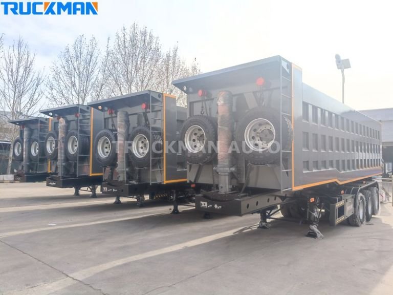Rear view of the rear dump trailer with robust design and spare tyre storage