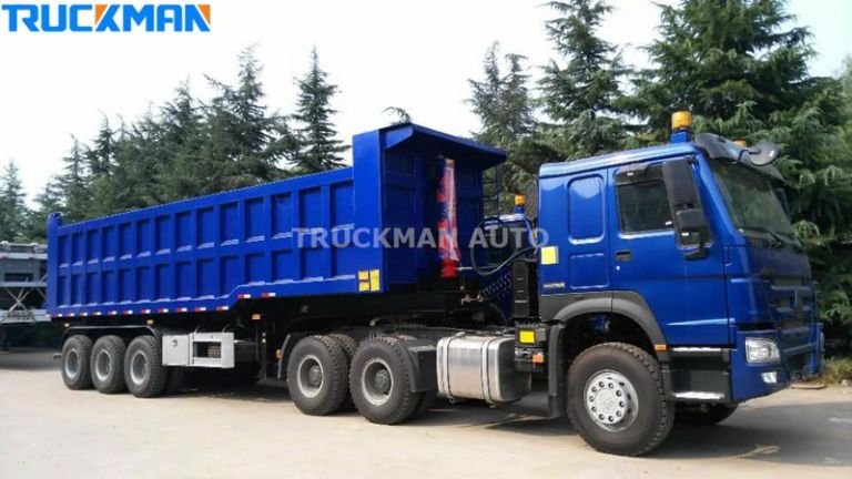 Blue heavy-duty rear-unloading semi-trailer, designed for transporting large quantities of bulk materials on construction sites
